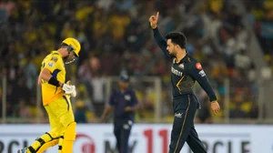 AP Photo /Ajit Solanki : Gujarat Titans' Rashid Khan celebrates the wicket of Chennai Super Kings' Mitchell Santner, left, during the Indian Premier League cricket match between Chennai Super Kings and Gujarat Titans in Ahmedabad.