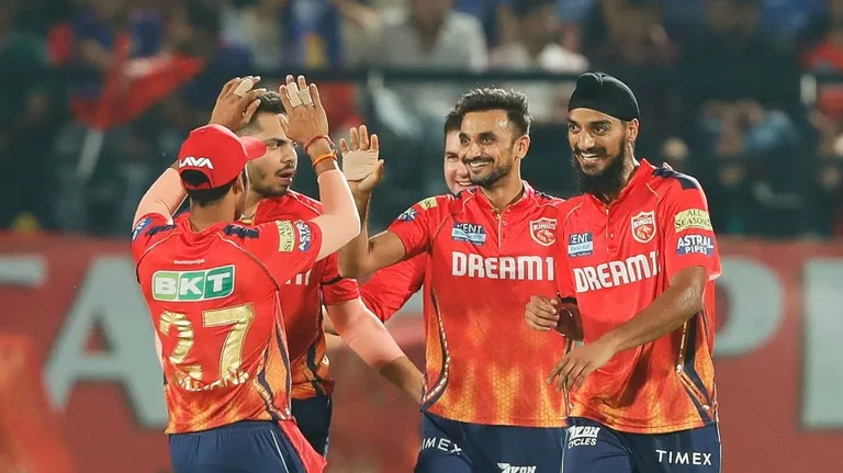 Harshal Patel (centre) with Punjab Kings players celebrating after taking a wicket in IPL 2024. - Photo: X/ @CricCrazyJohns