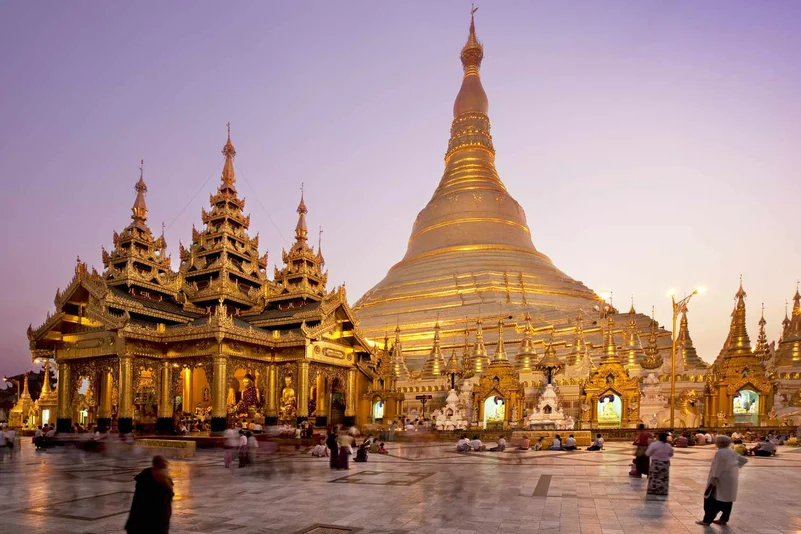 Shwedagon Pagoda glowing in the evening light.