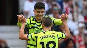 Kai Havertz celebrates a goal with Arsenal teammate Leandro Trossard during their English Premier League game against Manchester United at Old Trafford on Sunday (May 12).