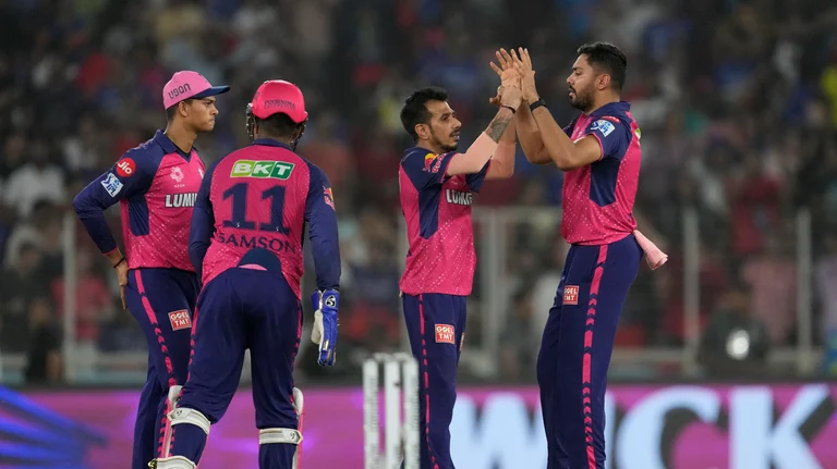 Rajasthan Royals' Yuzvendra Chahal, second right, celebrates with teammates after the dismissal of Royal Challengers Bengaluru's Virat Kohli during the Indian Premier League eliminator cricket match between Royal Challengers Bengaluru and Rajasthan Royals in Ahmedabad. - AP Photo/Ajit Solanki
