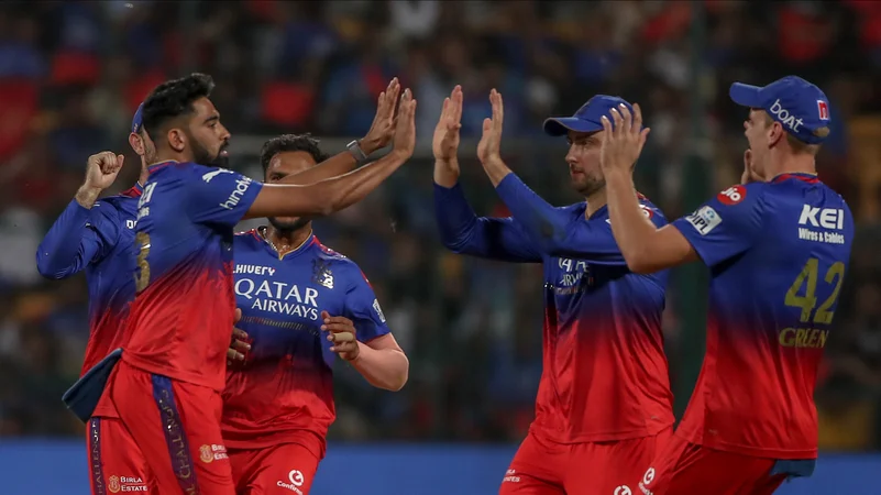Mohammed Siraj celebrating with teammates in IPL 2024. AP Photo