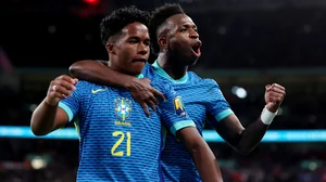 Endrick celebrates with Vinicius after scoring against England in March