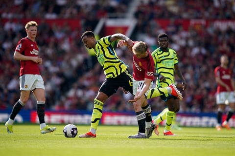 Arsenal's Gabriel challenges for the ball with United's Rasmus Hojlund