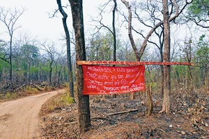 Photo: Dinesh Parab : At Polling Time: A banner of the CPI (Maoist) asking people to boycott the Lok Sabha elections hangs in a forest in south Gadchiroli