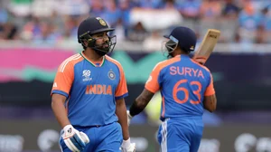 AP Photo/Adam Hunger : India's captain Rohit Sharma, left, walks off the field after losing his wicket as teammate Suryakumar Yadav, right, comes in to bat during the ICC Men's T20 World Cup cricket match between United States and India at the Nassau County International Cricket Stadium in Westbury, New York.