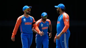 AP Photo/Ricardo Mazalan : India's Virat Kohli, left, speaks to captain Rohit Sharma, right, during the ICC Men's T20 World Cup cricket match.