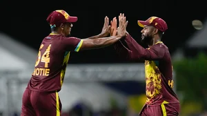 AP Photo/Ricardo Mazalan : West Indies' Shai Hope, right, is congratulated by teammate Gudakesh Motie after taking a catch to dismiss United States' Andries Gous during the men's T20 World Cup cricket match between the USA and the West Indies at Kensington Oval, Bridgetown, Barbados.