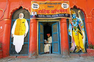 Photo: Suresh K. Pandey : Large cutouts of Prime Minister Narendra Modi and Lord Ram in front of a temple in Ayodhya