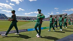 (AP Photo/Adam Hunger) : Bangladesh players walk into the field prior to the start of the ICC Men's T20 World Cup cricket match between Bangladesh and South Africa at the Nassau County International Cricket Stadium in Westbury, New York, Monday, June 10, 2024. 