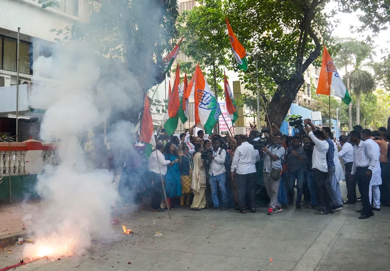 Congress supporters celebrate the party's lead during counting of votes for Lok Sabha elections - Kunal Patil