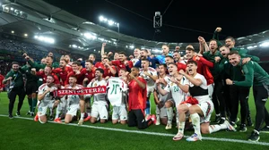 Hungary players celebrate with Barnabas Varga's shirt on Sunday.