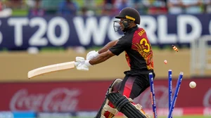 (AP Photo/Ramon Espinosa) : Papua New Guinea's Sese Bau is bowled by West Indies' Alzarri Joseph during an ICC Men's T20 World Cup cricket match at Guyana National Stadium in Providence, Guyana, Sunday, June 2, 2024. 
