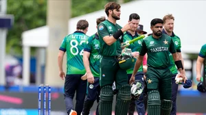 AP Photo/Lynne Sladky : Pakistan's Shaheen Shah Afridi, third left, gestures as he leaves the field with captain Babar Azam after Pakistan won the ICC Men's T20 World Cup cricket match against Ireland at the Central Broward Regional Park Stadium, Lauderhill.
