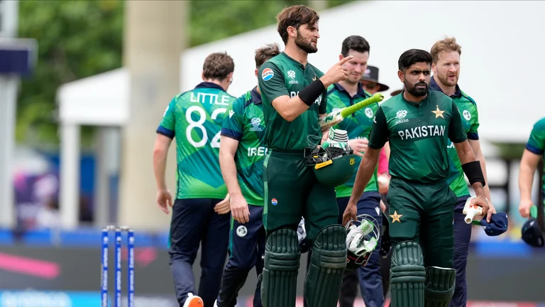 Pakistan's Shaheen Shah Afridi, third left, gestures as he leaves the field with captain Babar Azam after Pakistan won the ICC Men's T20 World Cup cricket match against Ireland at the Central Broward Regional Park Stadium, Lauderhill. - AP Photo/Lynne Sladky