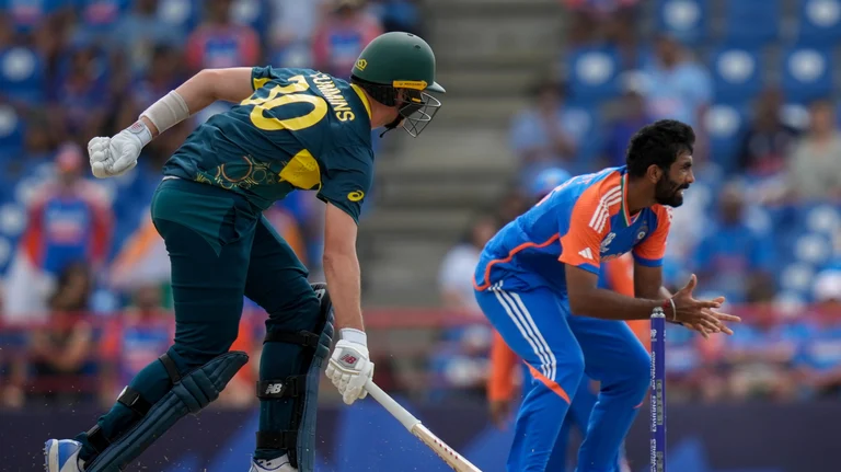 Australia's Pat Cummins scores runs during an ICC Men's T20 World Cup cricket match against India at Darren Sammy National Cricket Stadium in Gros Islet, Saint Lucia. - AP Photo/Ramon Espinosa