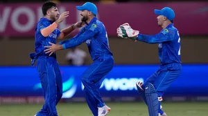 AP/PTI : Afghanistan's Fazalhaq Farooqi, left, celebrates the dismissal of New Zealand's Daryl Mitchell during their ICC Men's T20 World Cup  2024 match at Providence Stadium, Guyana on June 7, 2024.