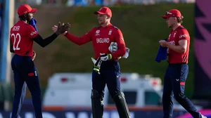 AP Photo/Ricardo Mazalan : England's captain Jos Buttler, centre, celebrates with Jofra Archer, left, and Sam Curran after winning an ICC Men's T20 World Cup cricket match against Namibia at Siv Vivian Richards Stadium in North Sound, Antigua and Barbuda.