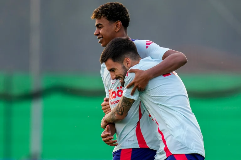Spain's Lamine Yamal, left, hugs his teammate Spain's Alejandro Baena during a training session at their base camp in Donaueschingen, Germany, Tuesday, June 25, 2024. -  (AP Photo/Manu Fernandez)