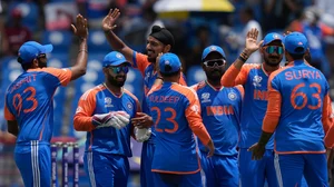Photo: AP/PTI : Players of India celebrate the dismissal of Australia's David Warner during an ICC Men's T20 World Cup cricket match at Darren Sammy National Cricket Stadium in Gros Islet, Saint Lucia.
