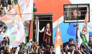 Getty Images : Congress leader Rahul Gandhi is addressing from his custom-made bus during the Bharat Jodo Nyay Yatra in Kohima, India, in the northeastern state of Nagaland, on January 16, 2024. 