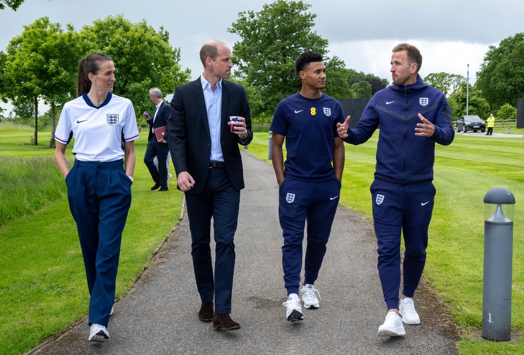 From left, Jill Scott, Britain's Prince William, Ollie Watkins and Harry Kane during a visit to St George's Park, in Burton upon Trent, Staffordshire.