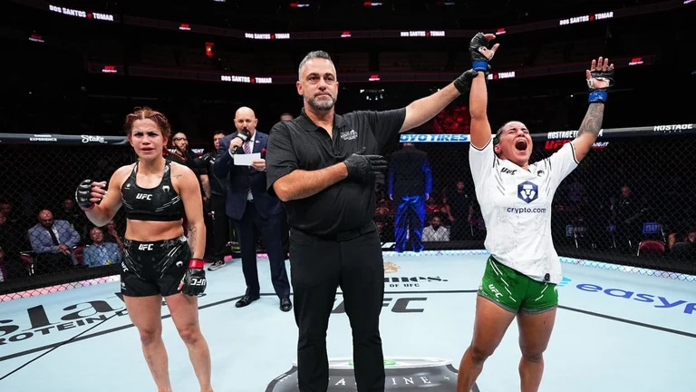 Puja Tomar of India celebrates victory at the Ultimate Fighting Championship (UFC) held in UFC Louisville in Kentucky on June 8, Saturday. - UFC 