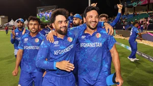 Rashid Khan and Gulbadin Naib celebrate Afghanistan reaching the T20 World Cup semi-finals.
