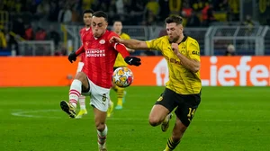 AP/Martin Meissner : File photo of PSV Eindhoven's Sergino Dest (left) in action during their the UEFA Champions League 2023-24 match against Borussia Dortmund.