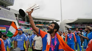 AP/Ramon Espinosa : India's Jasprit Bumrah celebrates with the winners' trophy after India won the ICC Men's T20 World Cup final cricket match against South Africa at Kensington Oval in Bridgetown, Barbados, Saturday, June 29, 2024.