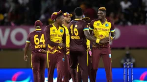 (AP Photo/Ramon Espinosa) : West Indies players listen to their national anthem before an ICC Men's T20 World Cup cricket match against Uganda at Guyana National Stadium in Providence, Guyana, Saturday, June 8, 2024. 
