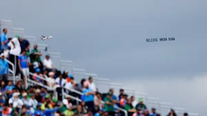 AP Photo/Eduardo Munoz : An aircraft tows a banner which reads "Release Imran Khan" as it flies over the venue of the ICC Men's T20 World Cup cricket match between India and Pakistan at the Nassau County International Cricket Stadium in Westbury, New York, Sunday, June 9, 2024.