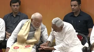 PTI Screengrab : Nitish Kumar Grabs PM's Inked Finger At Nalanda Opening |