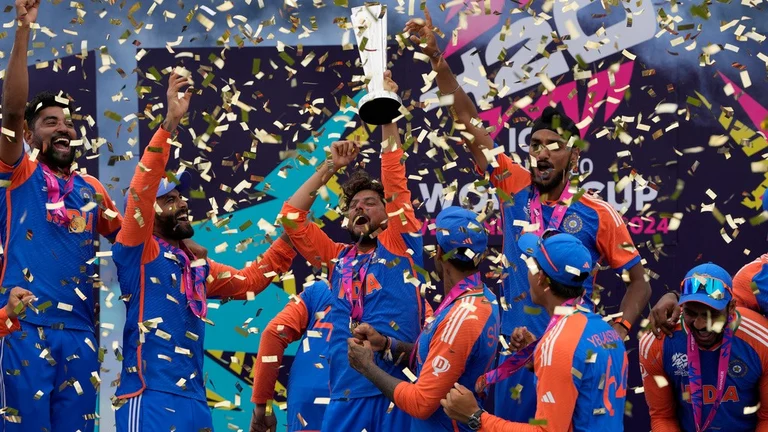 Indian players celebrate with the winners trophy after defeating South Africa in the ICC Men's T20 World Cup final cricket match at Kensington Oval in Bridgetown, Barbados, Saturday, June 29, 2024 - AP/Ricardo Mazalan