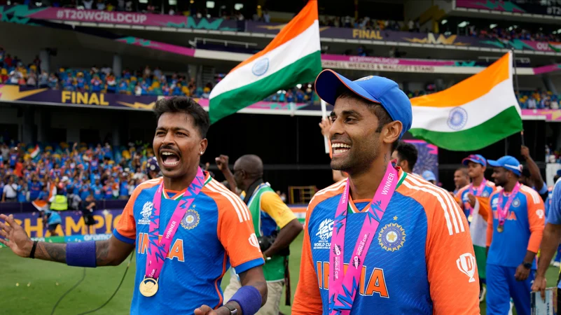 Indias Hardik Pandya, left, and teammate Suryakumar Yadav celebrate after India won the ICC Mens T20 World Cup final. AP Photo