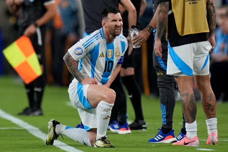 Argentina's Lionel Messi grimaces during a Copa America Group A soccer match against Chile in East Rutherford, N.J., Tuesday, June 25, 2024.  - (AP Photo/Julia Nikhinson)


