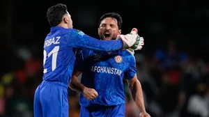 AP/Ramon Espinosa : AFG all-rounder Gulbadin Naib (right) in action at the T20 World Cup 2024.