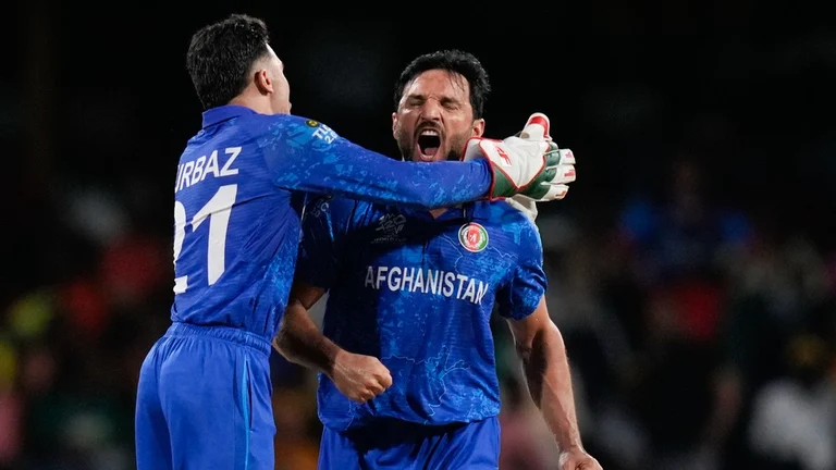 AFG all-rounder Gulbadin Naib (right) in action at the T20 World Cup 2024. - AP/Ramon Espinosa