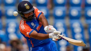 AP Photo/Ramon Espinosa : India's captain Rohit Sharma hits for six runs against Australia during an ICC Men's T20 World Cup cricket match at Darren Sammy National Cricket Stadium in Gros Islet, Saint Lucia, Monday, June 24, 2024.