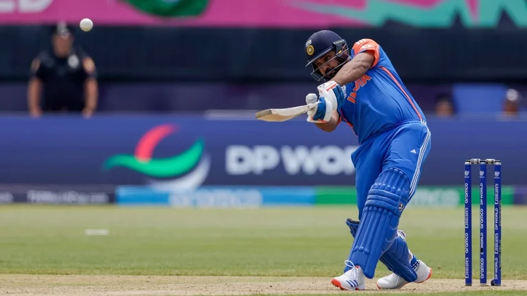 India captain Rohit Sharma plays a shot for six runs against Ireland during an ICC Men's T20 World Cup cricket match at the Nassau County International Cricket Stadium in Westbury, New York, Wednesday, June 5, 2024. - AP Photo/Adam Hunger