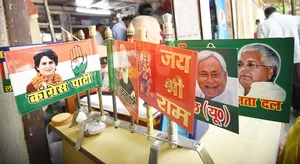 Getty Images : Various political parties flags on sell at a shop in Patna ahead of Lok Sabha elections.