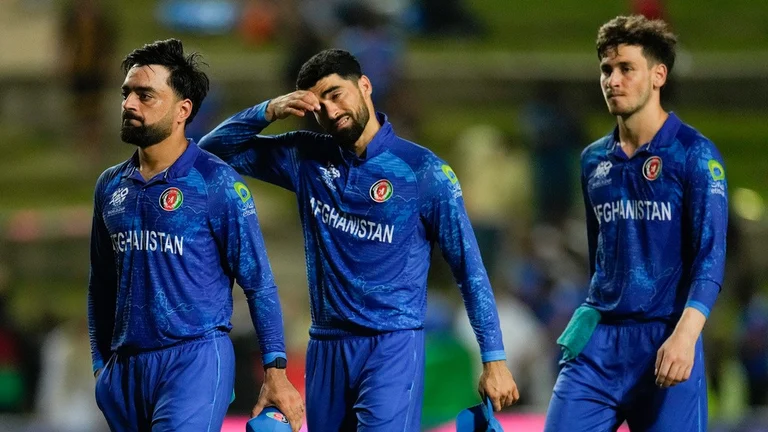 Afghanistan captain Rashid Khan and teammates walk off after losing to South Africa in their ICC T20 World Cup 2024 semi-final clash in Trinidad on Thursday (June 27). - AP/Ricardo Mazalan