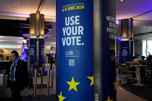 Associated Press : A man walks through a hallway during a voting night event at the European Parliament in Brussels
