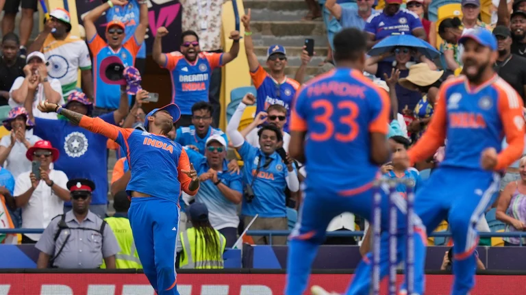 India's Suryakumar Yadav, left, takes the catch to get South Africa's David Miller out as teammates Virat Kohli, right, and Hardik Pandya celebrate during the ICC Men's T20 World Cup final cricket match between India and South Africa at Kensington Oval in Bridgetown, Barbados. - AP Photo/Ramon Espinosa