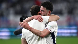Declan Rice shares an embrace with England manager Gareth Southgate on Sunday.