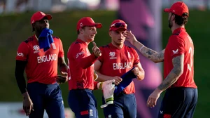 AP Photo/Ricardo Mazalan : England's captain Jos Buttler, second left, celebrates with teammates winning an ICC Men's T20 World Cup cricket match against Namibia at Sir Vivian Richards Stadium in North Sound, Antigua and Barbuda, Saturday, June 15, 2024.