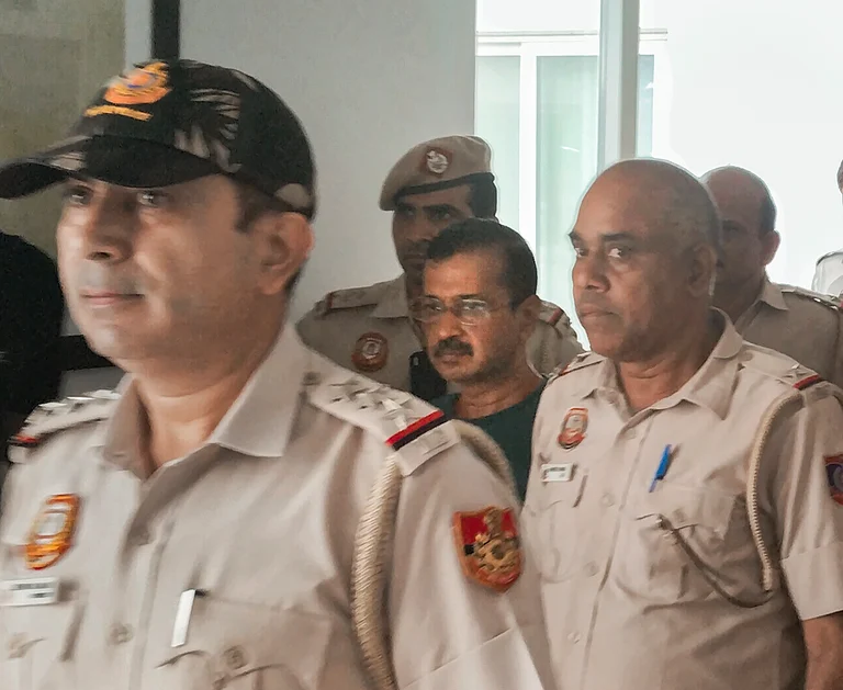 Police personnel accompaying Delhi CM Arvind Kejriwal inside Rose Avenue Court | - PTI