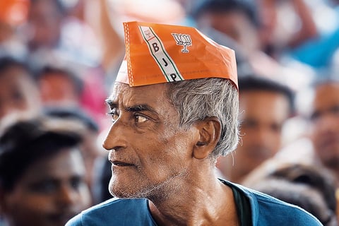 A supporter at a Bharatiya Janata Party rally at Mosat Bazar Ground, Hooghly district