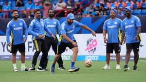 AP Photo/Lynne Sladky : India's captain Rohit Sharma, third right, plays with a soccer ball as a wet outfield delayed the start of the ICC Men's T20 World Cup cricket match between Canada and India at the Central Broward Regional Park Stadium, Lauderhill.