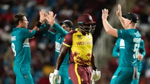 Photo: AP/PTI : West Indies captain Rovman Powell walks from the field after he was dismissed during the men's T20 World Cup cricket match between the West Indies and New Zealand at the Brian Lara Cricket Academy, Tarouba, Trinidad and Tobago.